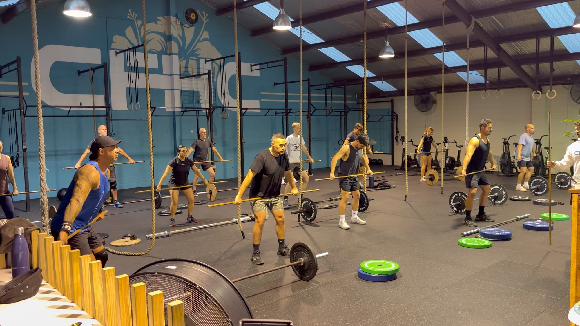 A coached class working through a barbell warm-up at CrossFit Hibiscus Coast