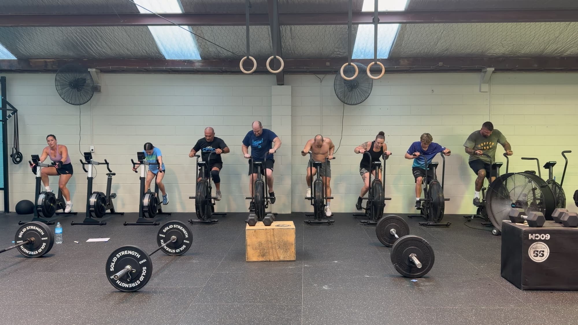 Members on the assault bikes during a conditioning piece at CrossFit Hibiscus Coast